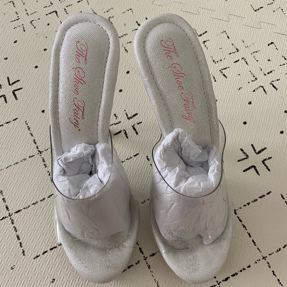 Never worn Shoe Fairy Olympian Heels!